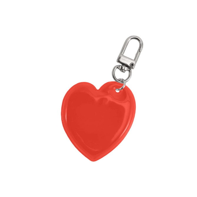 A red heart-shaped reflective keychain with a metal clip. It has a glossy finish and a standard keyring attachment.