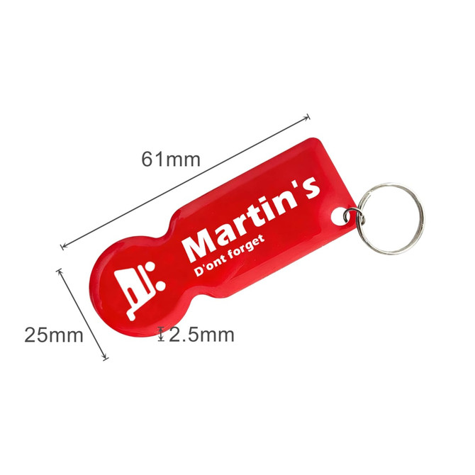 A red custom shape trolley coin keyring featuring a keyring attachment and a branding logo.