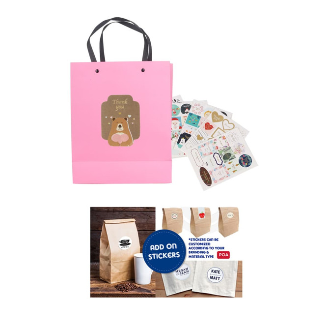 A pink laminated handle bag with a cute design, accompanied by decorative stickers and a coffee bag.