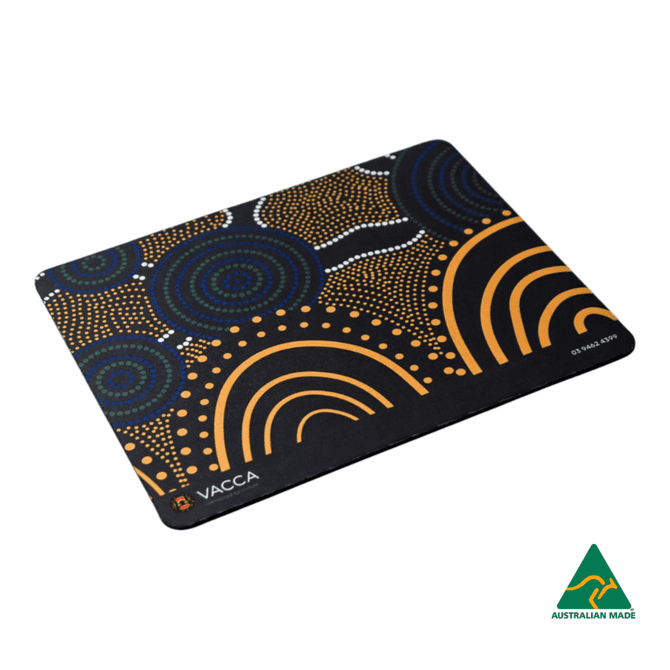 A mouse mat featuring a vibrant Aboriginal-inspired design in black, orange, and blue tones, with a logo.