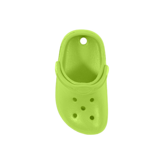 A bright green clog shoe-shaped charm with holes, featuring a circular hole at the top, and a curved back.