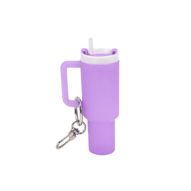 A purple glow-in-the-dark mini tumbler keyring with a straw and a metal keychain attachment.
