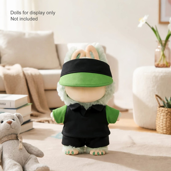 A plush doll racing suit set in green and black, displayed on a soft rug with a teddy bear nearby.