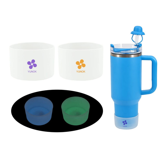 A drink bottle in blue with a handle, accompanied by two white containers and two silicone cups in green and dark blue.