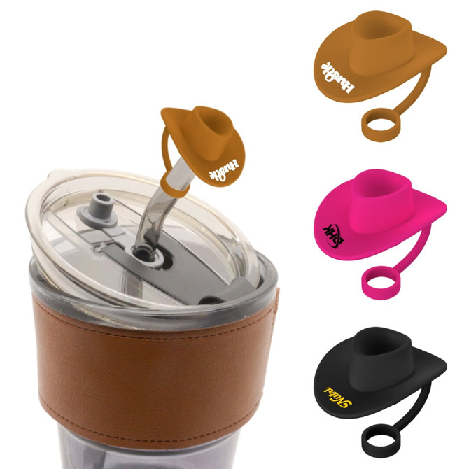 A drink bottle with a silicone cowboy hat straw cover in brown, pink, and black, featuring a logo.