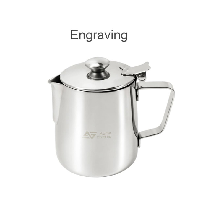 A stainless steel milk frothing pitcher with a lid, featuring a handle and a branded logo.