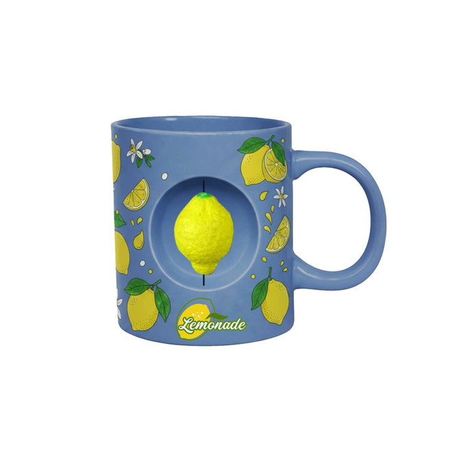 A blue ceramic coffee mug featuring lemon illustrations and a yellow spinning lemon toy in the centre.