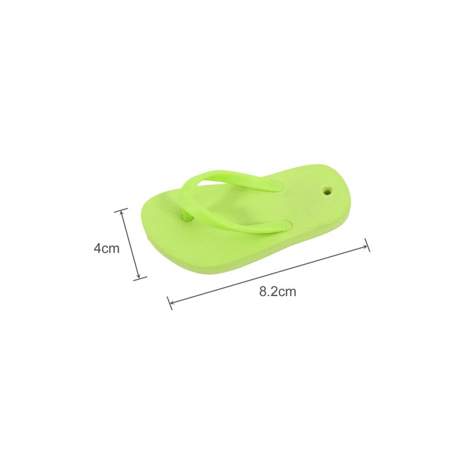 A green thong-shaped fridge magnet, measuring 8.2 cm by 4 cm, featuring a textured surface.