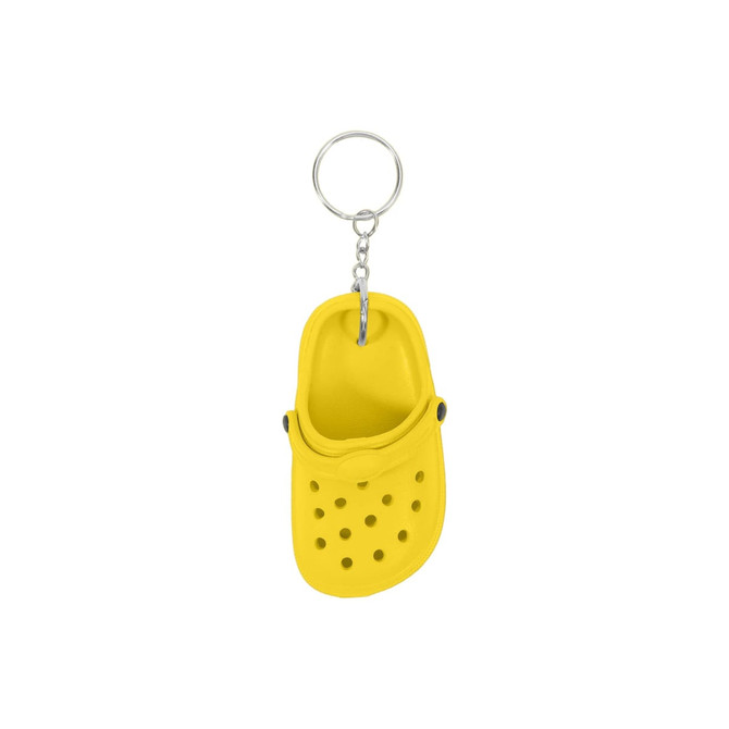 A yellow clog shoe keyring featuring ventilation holes and a metal chain attachment.