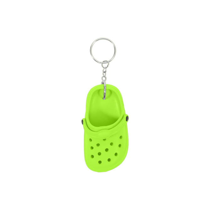 A bright green clog shoe keyring with perforations and a silver keyring attachment.