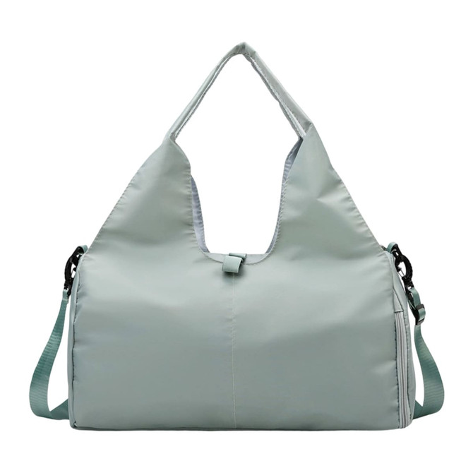 A light green duffle bag with a yoga mat strap, featuring a logo and adjustable shoulder strap.