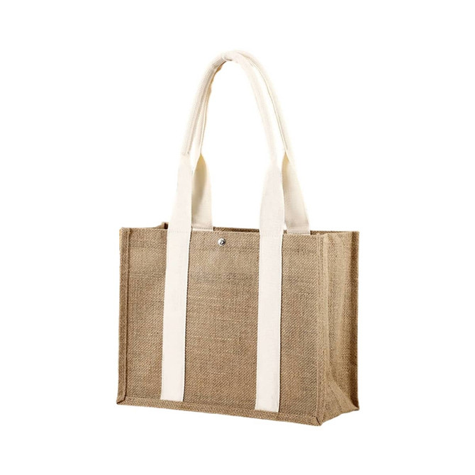 A jute tote bag in natural brown with cream handles and a metal snap closure. It features a branding logo.