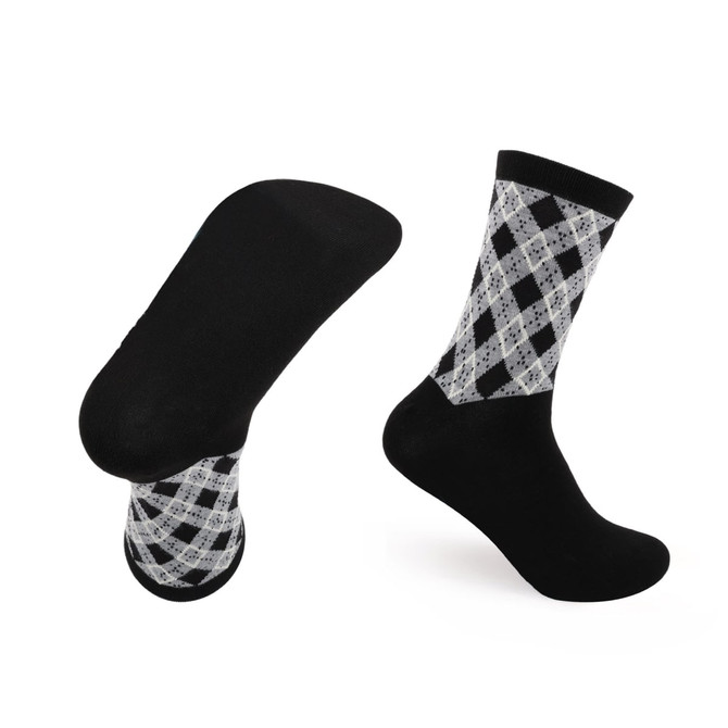 A pair of black and white patterned woven bamboo socks with a towel bottom. They feature a diamond check design.