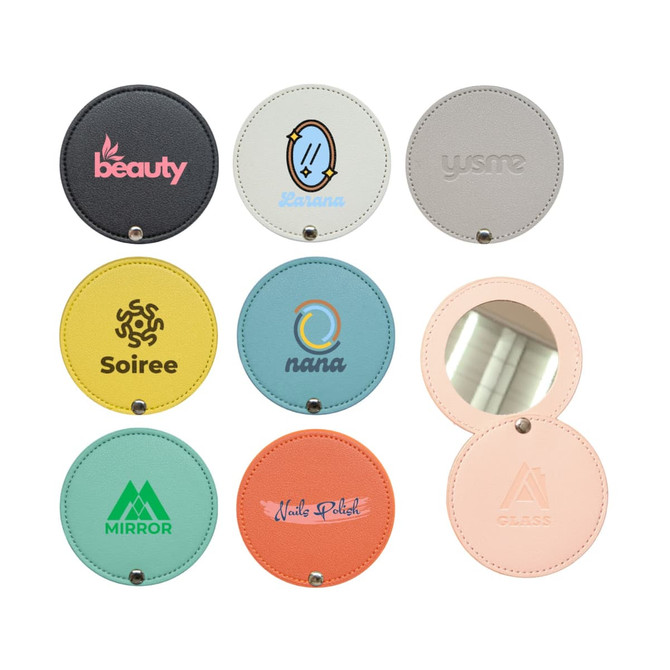 A round makeup mirror with various coloured and branded covers, featuring a reflective surface inside.