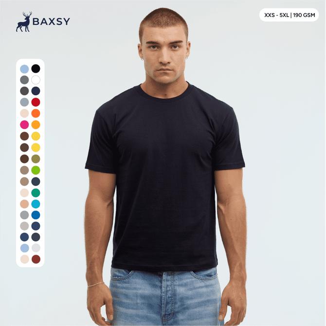 A model wears a navy blue Essential/Surf Tee, featuring a range of colour swatches on the side and a logo at the top.