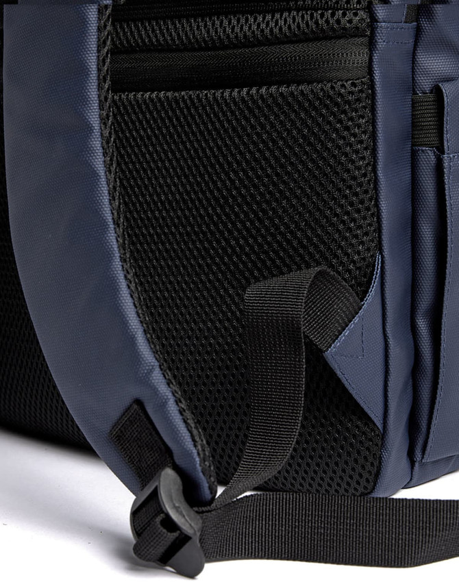 A navy blue backpack with mesh pockets and adjustable straps. It features a sleek design and exterior compartments.