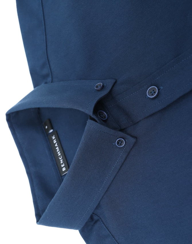 A navy blue cotton blend long-sleeve shirt with a folded collar and buttons, featuring a logo label.