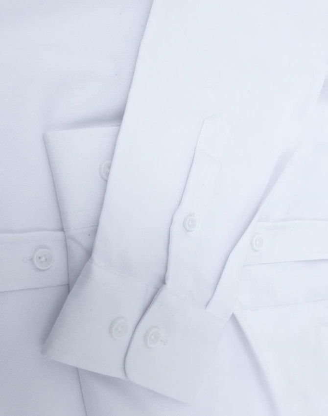 A white ladies' long-sleeve cotton blend shirt with button cuffs and a subtle branding detail.