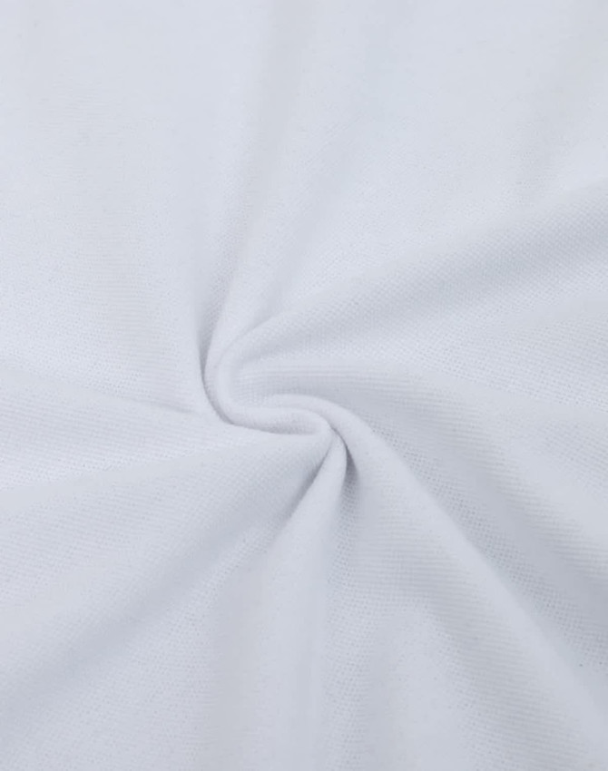 A close-up of white fabric featuring a smooth cotton/poly blend texture, with a slight sheen and circular pattern.