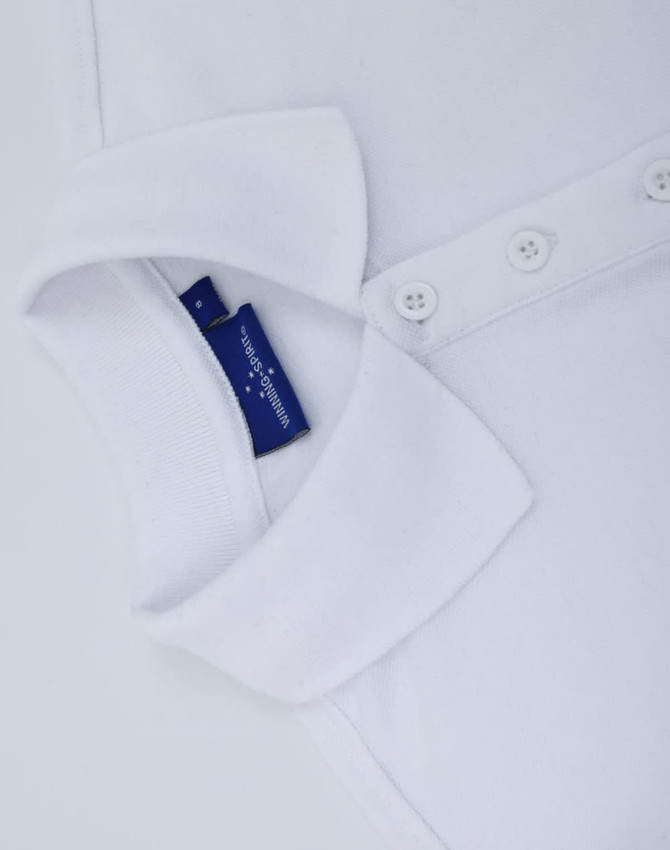 A white classic cotton/poly pique short sleeve polo shirt featuring a collar and buttons, with a tag visible.