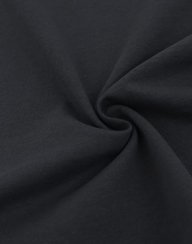 A close-up of a black heavy cotton fabric, showcasing its soft texture and smooth surface.