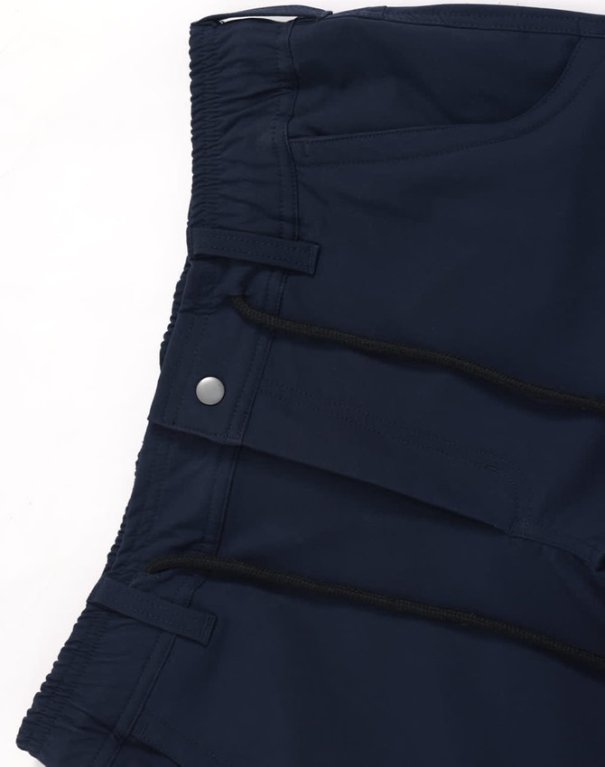 Navy water-repellent flexi work pants with tape detailing, featuring pockets and a smooth waistband. Includes a logo.