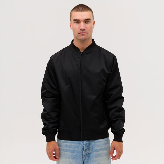 A black bomber jacket is displayed on a model, featuring a zip front and ribbed cuffs.