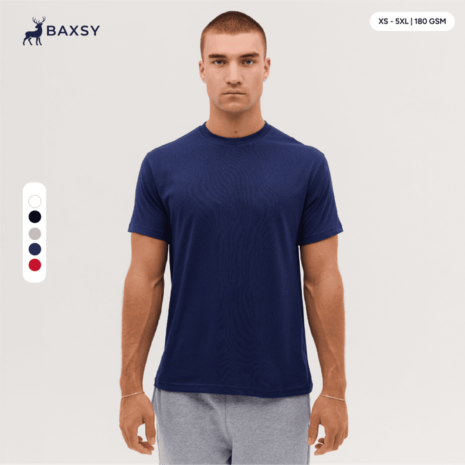 A navy blue T-shirt displayed on a model, featuring a round neckline and short sleeves. It has a logo.