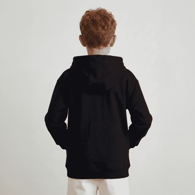 A black youth hoodie with a hood, featuring a simple design and no visible logos, worn by a child from the back.