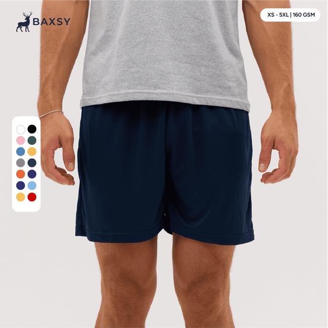 Navy shorts displayed on a model, featuring an elastic waistband and side pockets. Includes a colour selection chart.