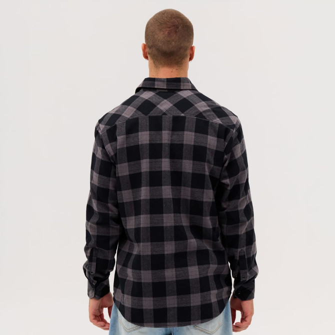 A black and grey checked flannel long sleeve shirt, viewed from the back, featuring a logo.