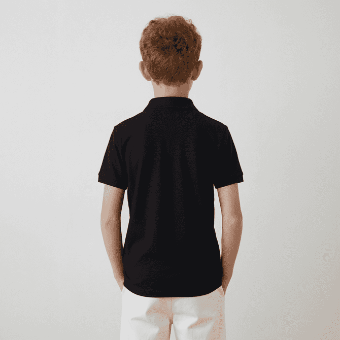 A black youth polo shirt viewed from the back. The shirt features short sleeves and a collar.