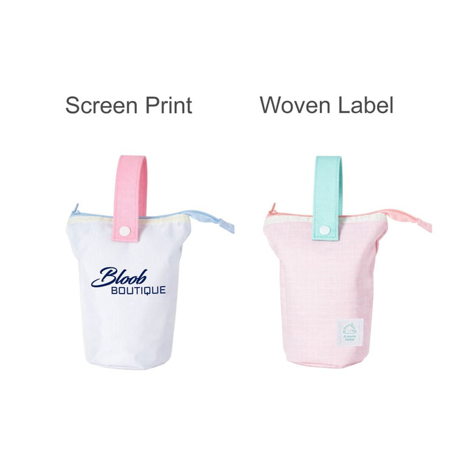 A foldable pencil case with a handle, available in pink and blue colour options, featuring a logo.