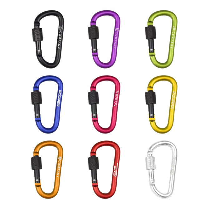 A collection of D-shaped screw lock keychains in various colours, including black, green, purple, yellow, orange, and silver, featuring logos.