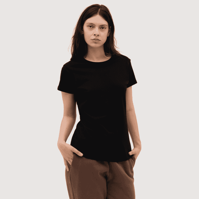 A black women's tee with a round neckline and short sleeves, modelled by a woman with long hair.