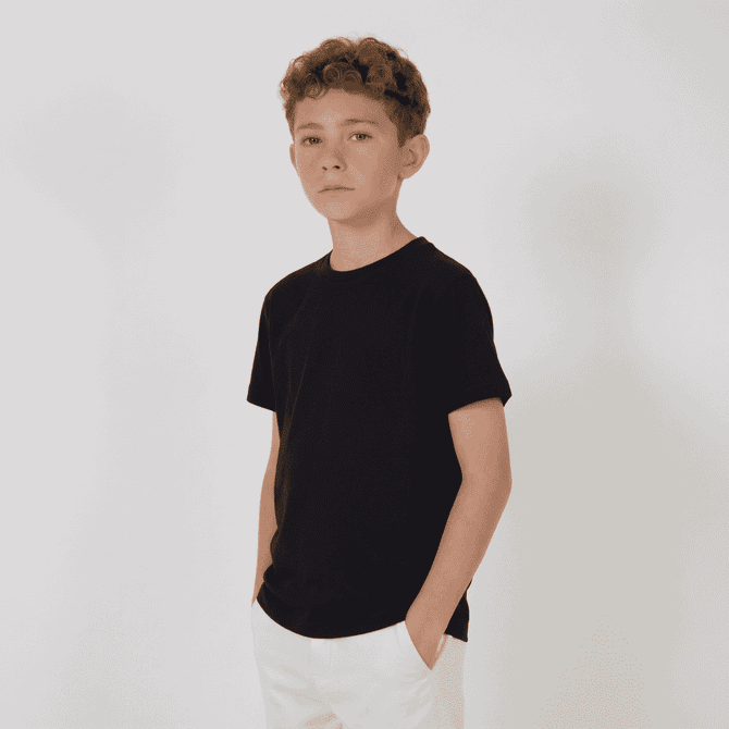 A youth essential tee in black, featuring a classic crew neck and short sleeves, displayed on a model.
