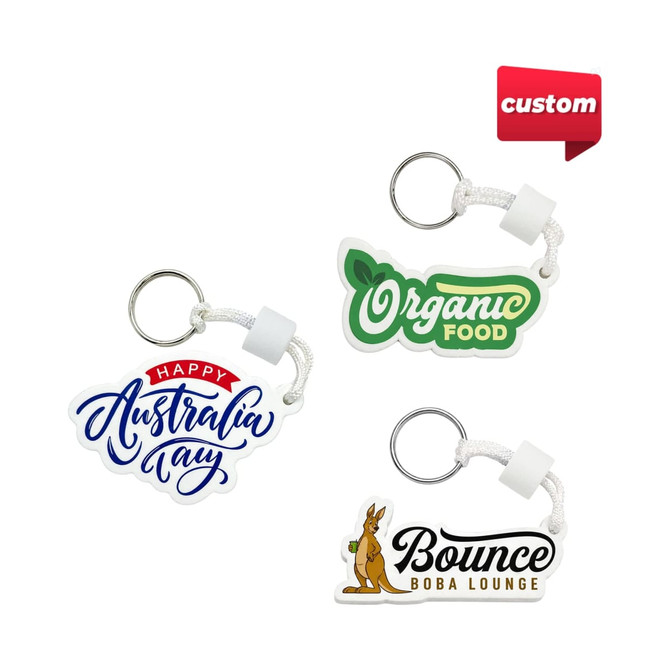 A set of three custom EVA floating keychains in various colours, featuring different designs and a metal ring.