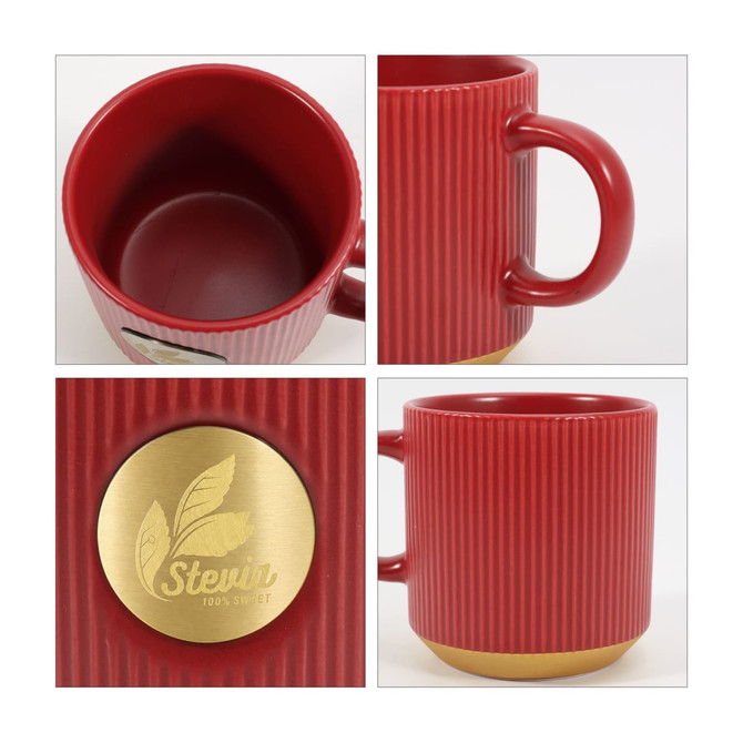 A red ceramic coffee mug with a ribbed design and a metallic bronze base, featuring a logo on one side.