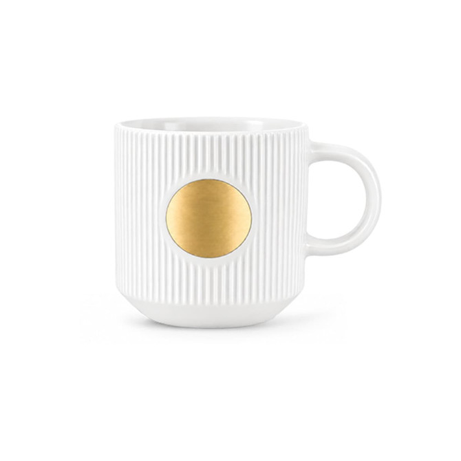 A ceramic mug in white with a textured design and a bronze medal feature on the front.