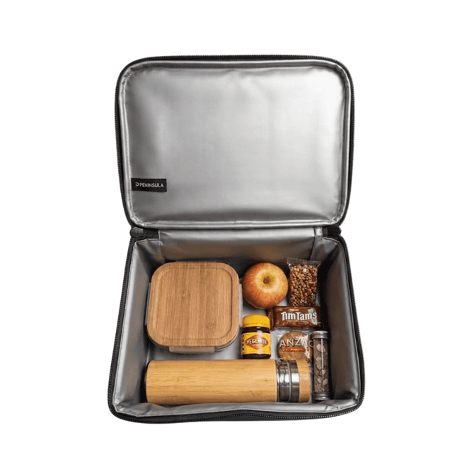 A cooler bag containing a drink bottle, lunch box, apple, and snacks, with a silver interior and a branding logo.