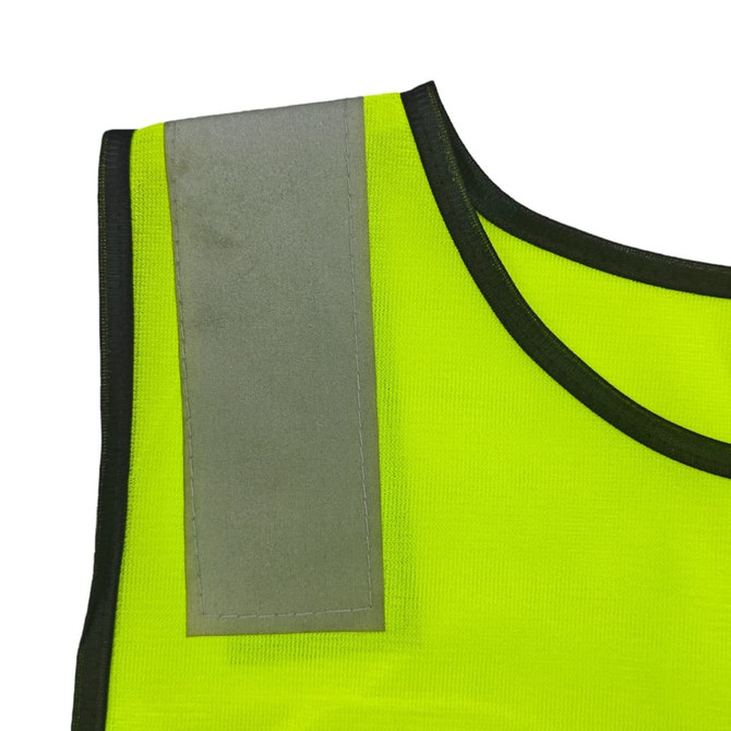 A bright yellow reflective safety vest featuring a grey reflective strip on the shoulder.