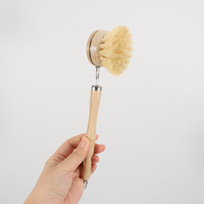 A long-handled wooden cleaning scrubber with a natural bristle head and a wooden handle.