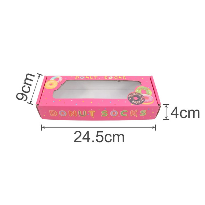 A large pink gift box with a rectangular window, designed for donut socks, featuring colourful donut graphics.