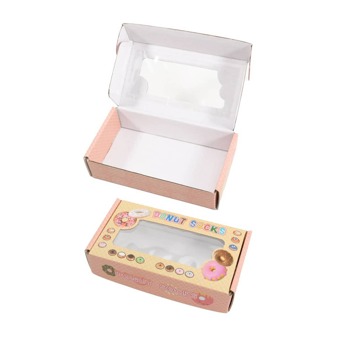 A medium pink gift box with a rectangular window, featuring a playful design and an inner compartment.