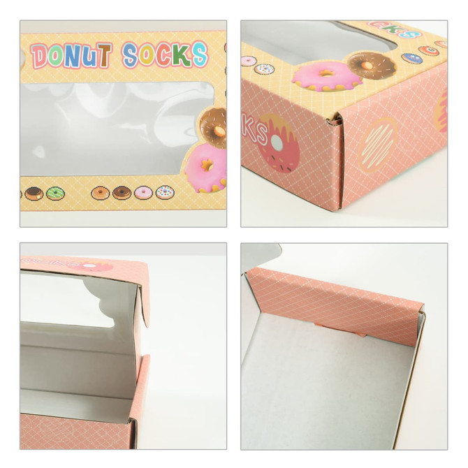A pink medium gift box with a rectangular window, featuring a donut pattern and a logo on the side.