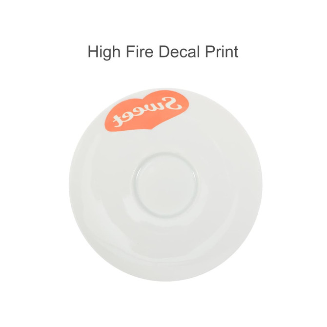 A white ceramic saucer with a smooth finish and a decorative red heart featuring the word "sweet." It has a logo.