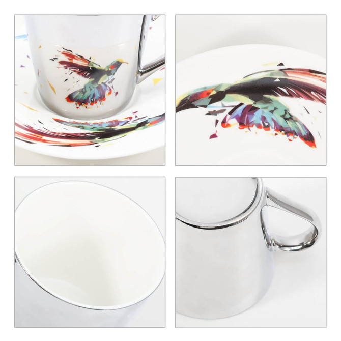 A ceramic coffee mug with a vibrant bird design and a sleek mirror-like finish, accompanied by a matching saucer.