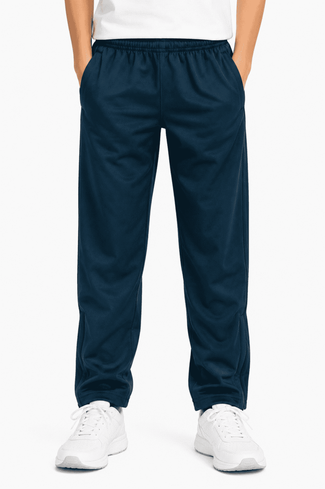 Navy track pants for kids with an elastic waistband and side pockets, featuring a logo on the front.