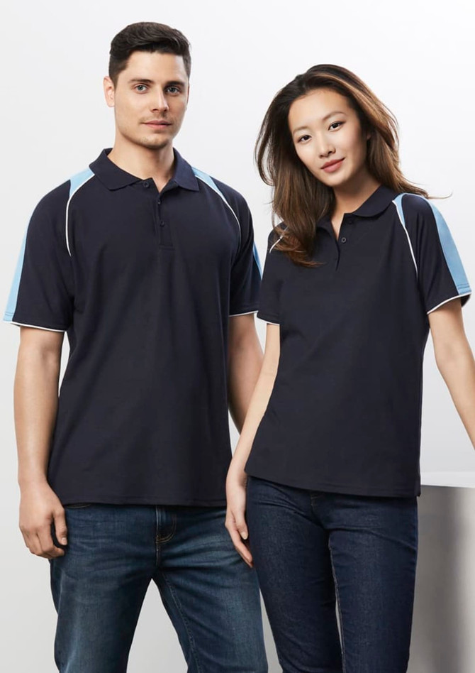 A navy blue women's polo shirt with light blue accents, featuring a collar and side detailing. It has a branding logo.