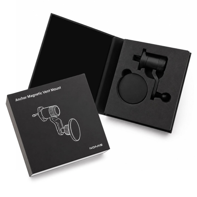 A black magnetic car phone holder in a sleek box with a logo, featuring a vent mount design.